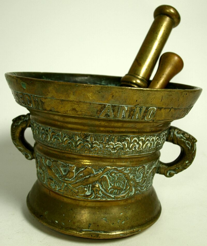 An early 17th century Flemish bronze mortar and two pestles