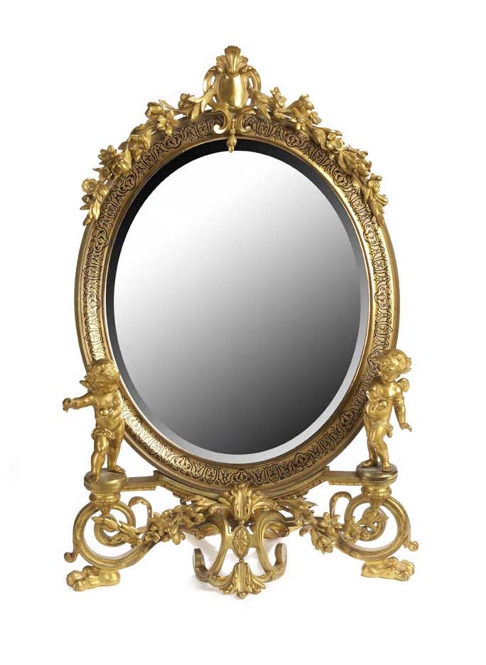 A late 19th century gilt brass dressing mirror,