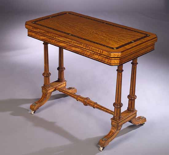 A late Victorian satinwood ebonised card table