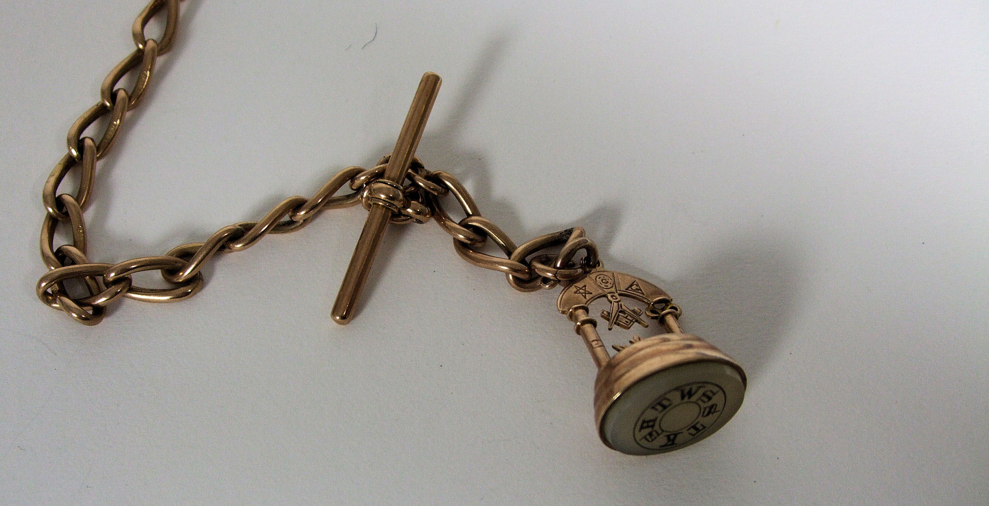 A 9ct gold Albert and fob