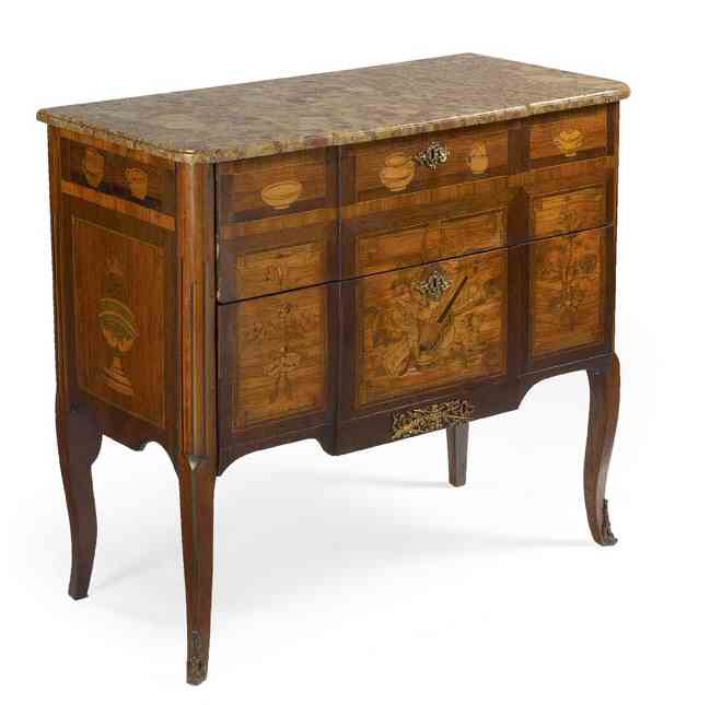 A late 18th century Transitional French provincial rosewood, tulipwood and marquetry commode