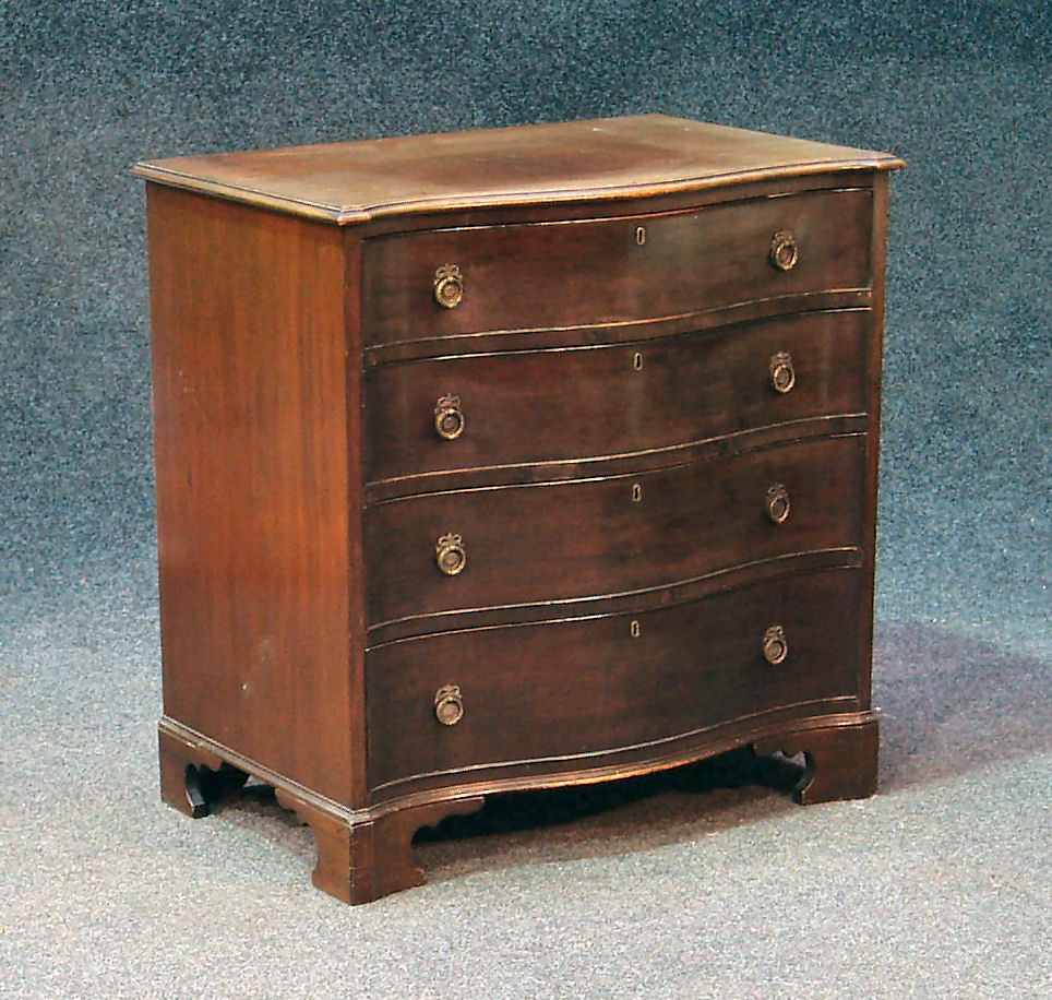 A Georgian style mahogany serpentine chest