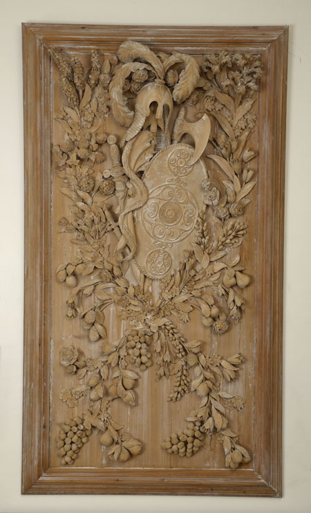 A large carved pine panel