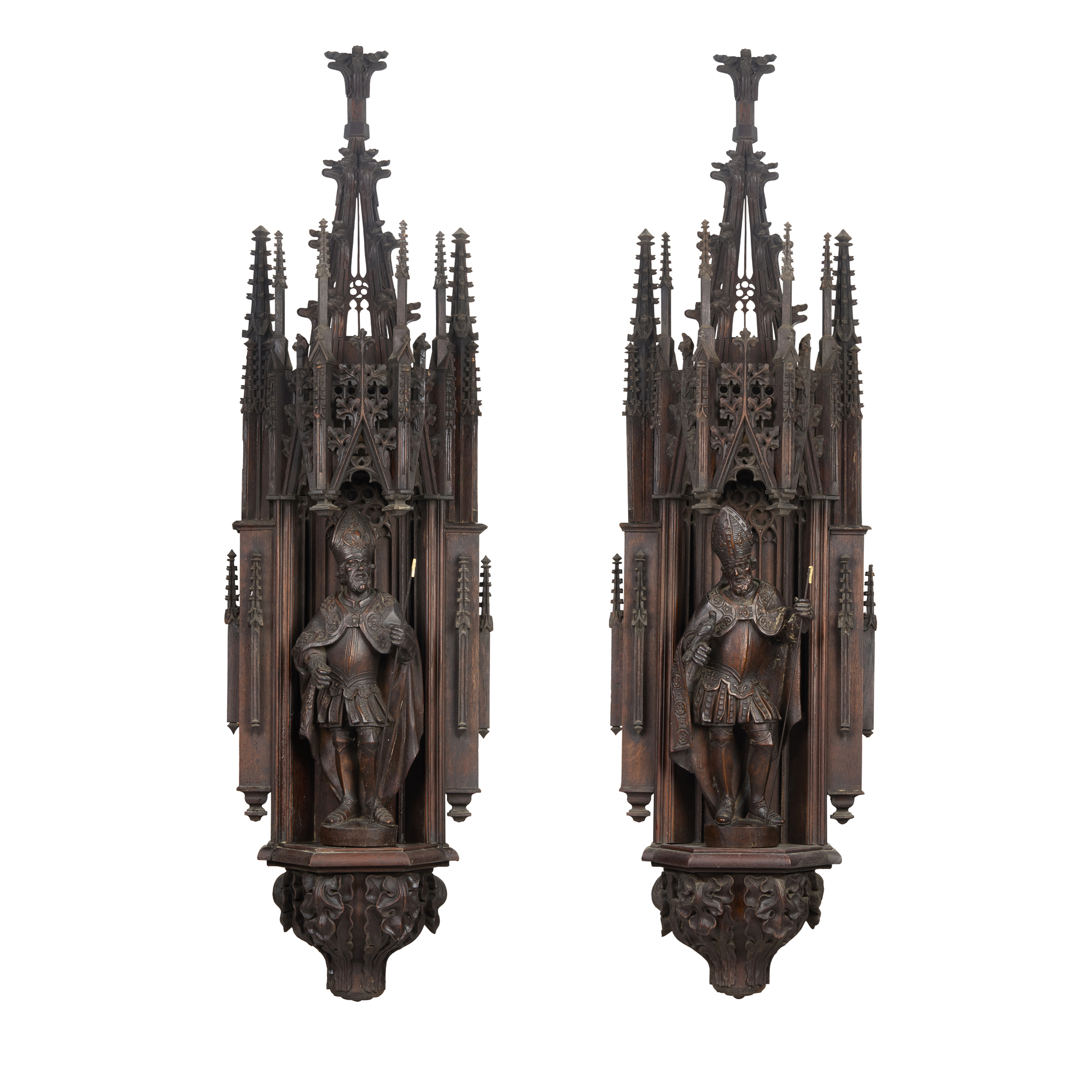 PAIR OF FLEMISH GOTHIC REVIVAL CARVED OAK AND FRUITWOOD BISHOP SAINTS AND ARCHITECTURAL NICHES