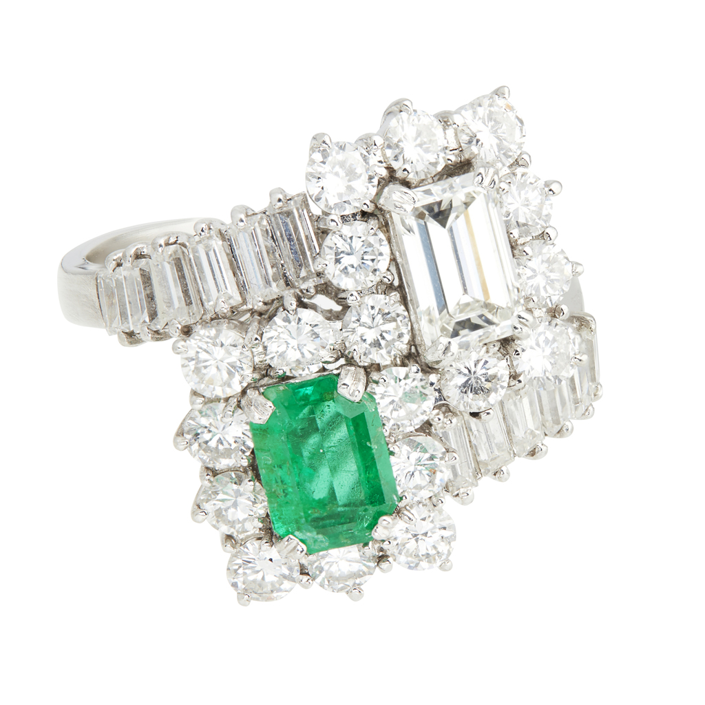 An emerald and diamond set ring