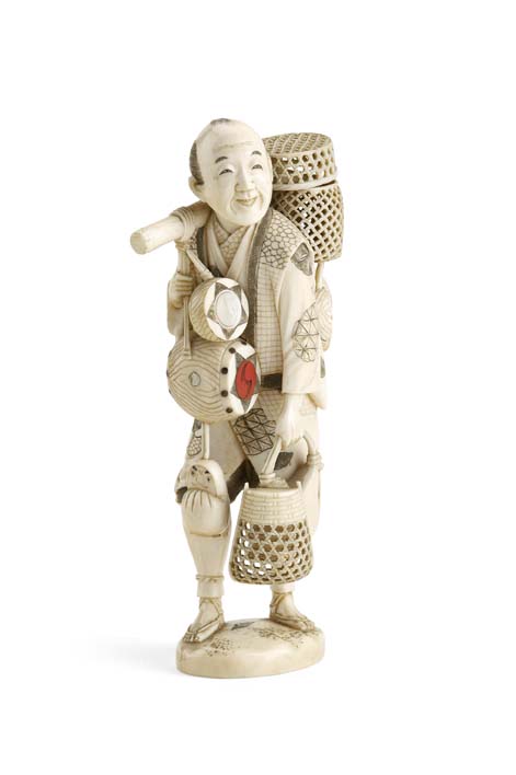 A Japanese ivory okimono of a basket maker, Meiji period