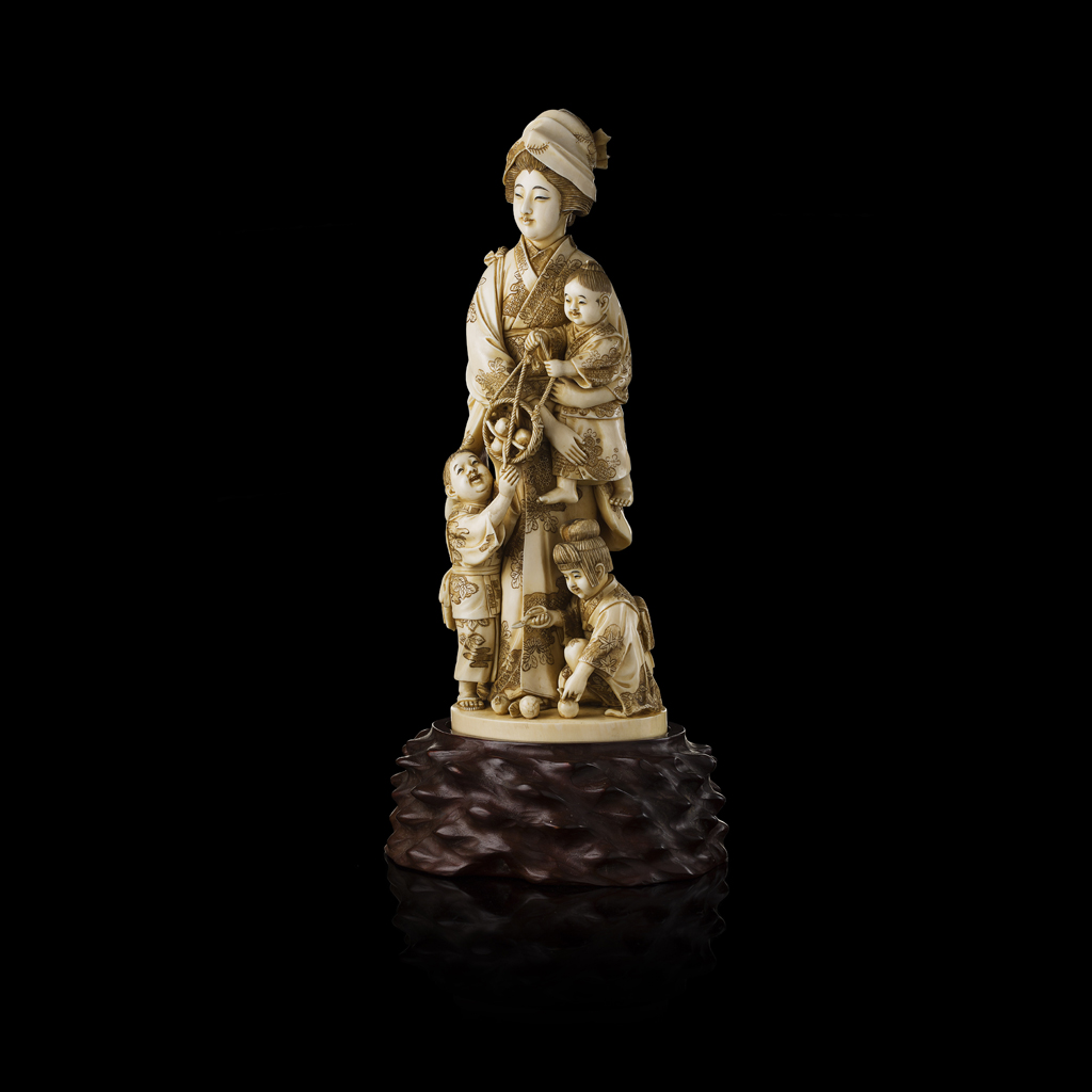 FINELY CARVED IVORY OKIMONO OF A LADY WITH THREE CHILDREN