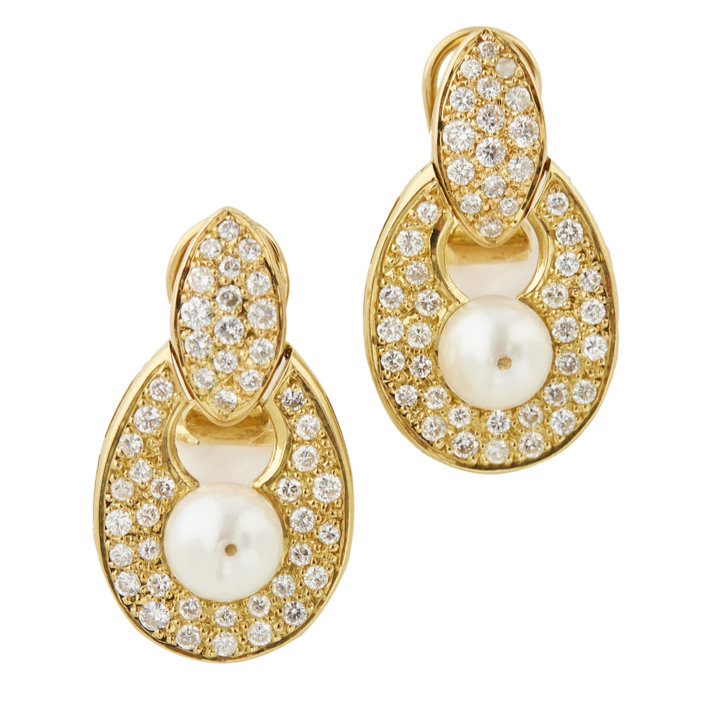 A pair of pearl and diamond set earrings