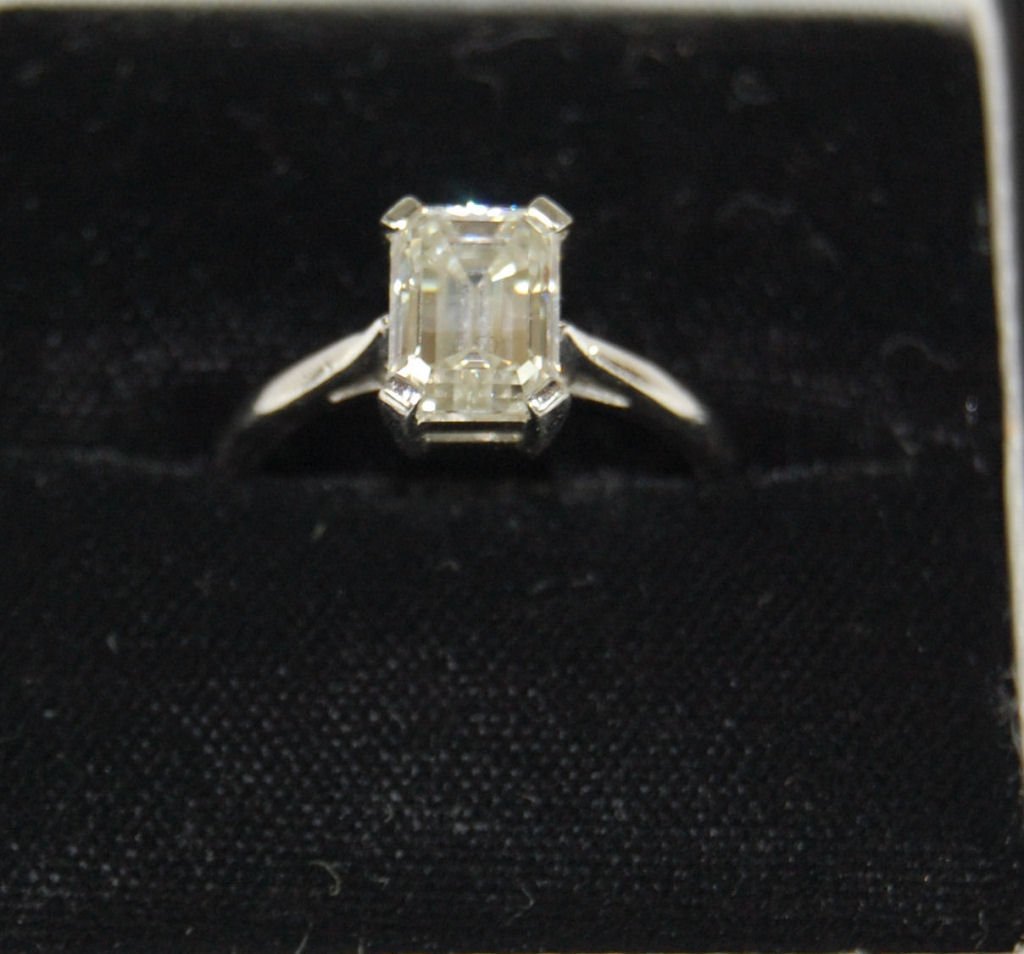 A contemporary platinum mounted diamond single-stone ring