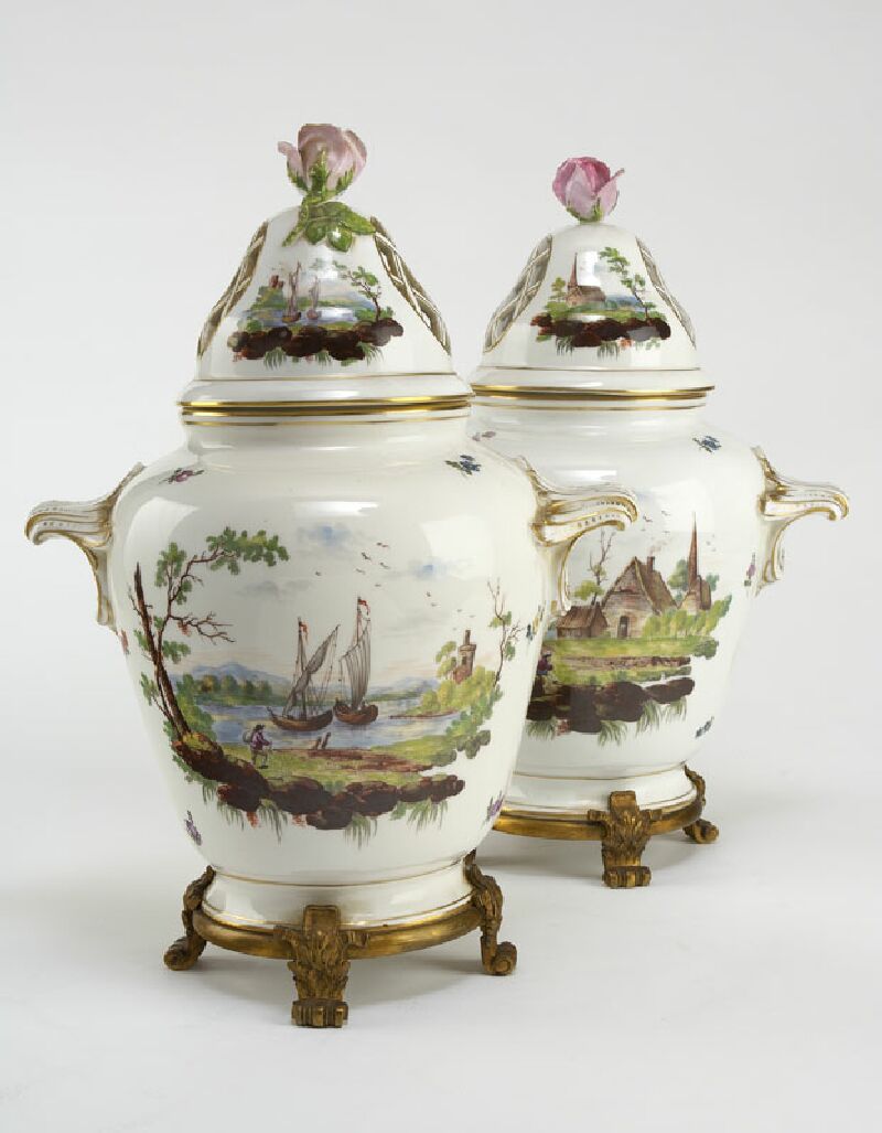 A pair of late 19th century Dresden giltmetal mounted vases and covers