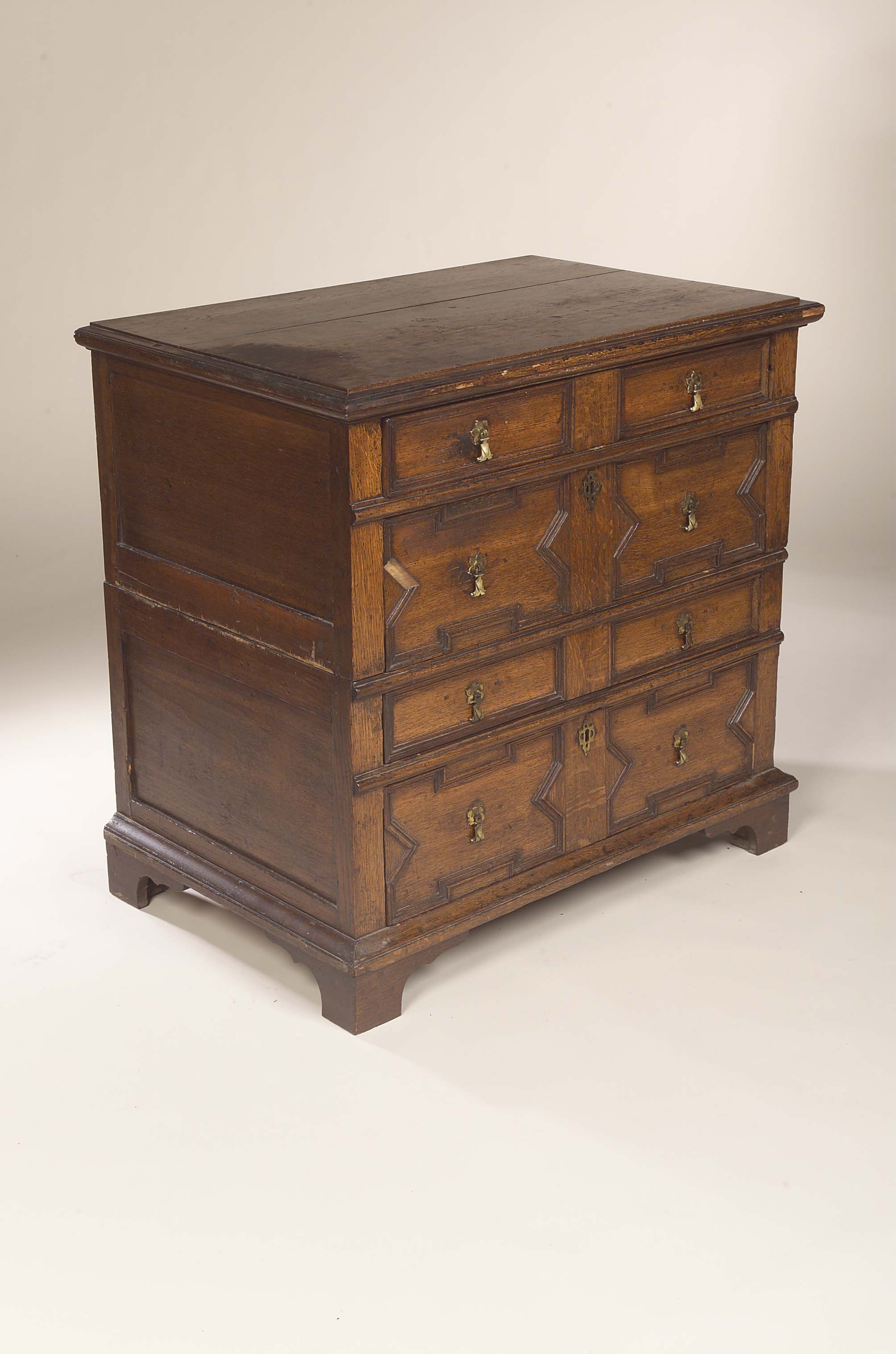 An early 18th century oak chest of drawers,
