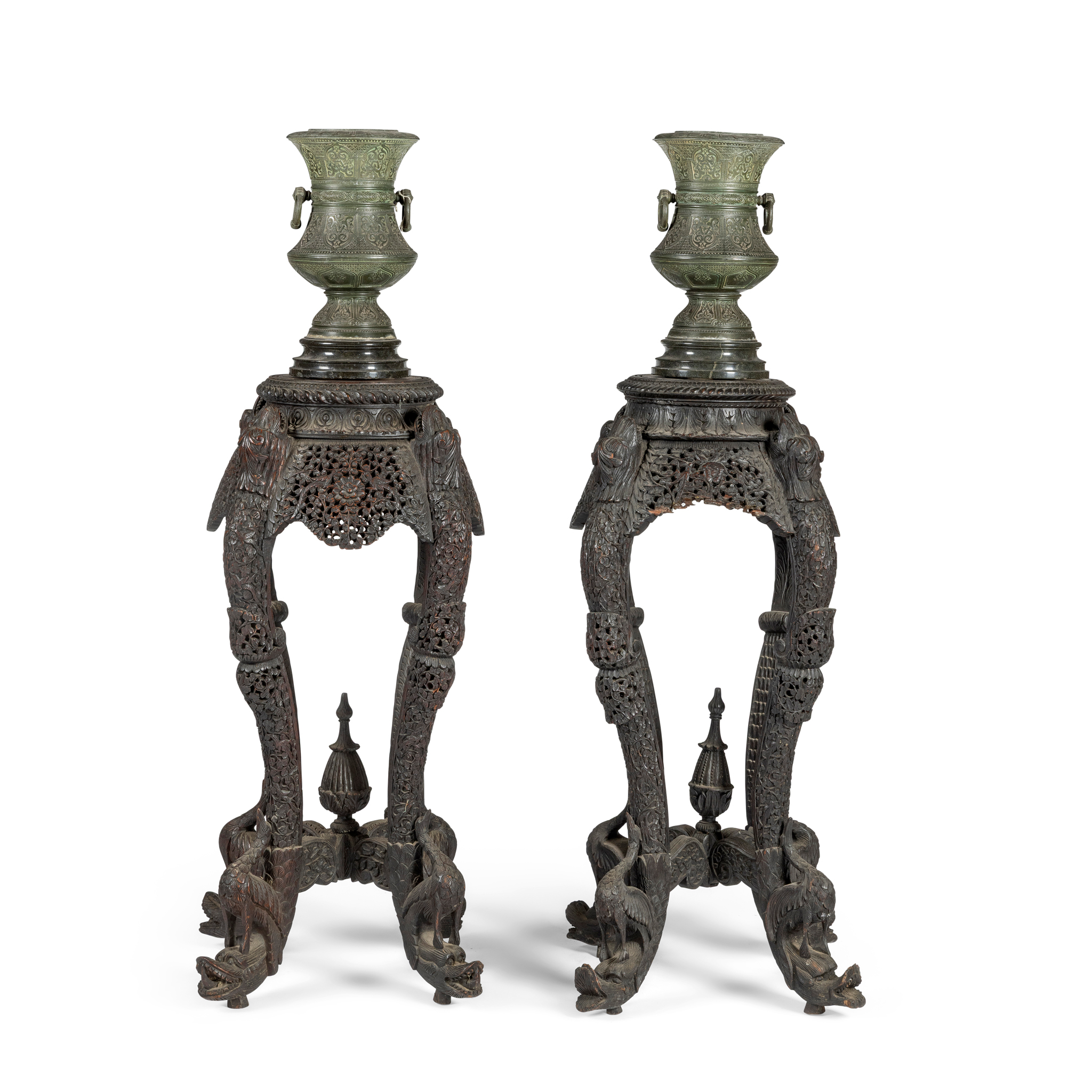 A PAIR OF ANGLO INDIAN HARDWOOD PIERCED TORCHERE STANDS