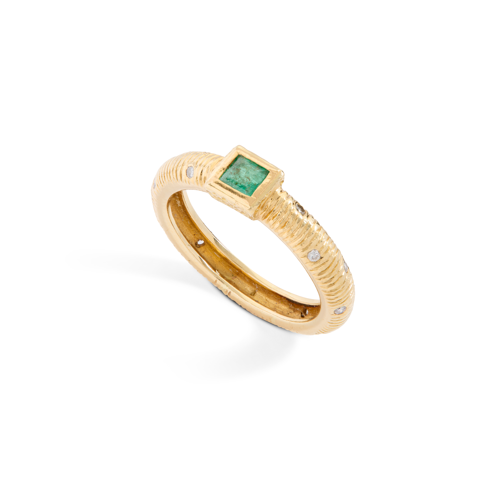An emerald and diamond dress ring