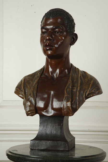 A late 19th/early 20th century Austrian painted terracotta bust of a Nubian boy by Goldscheider
