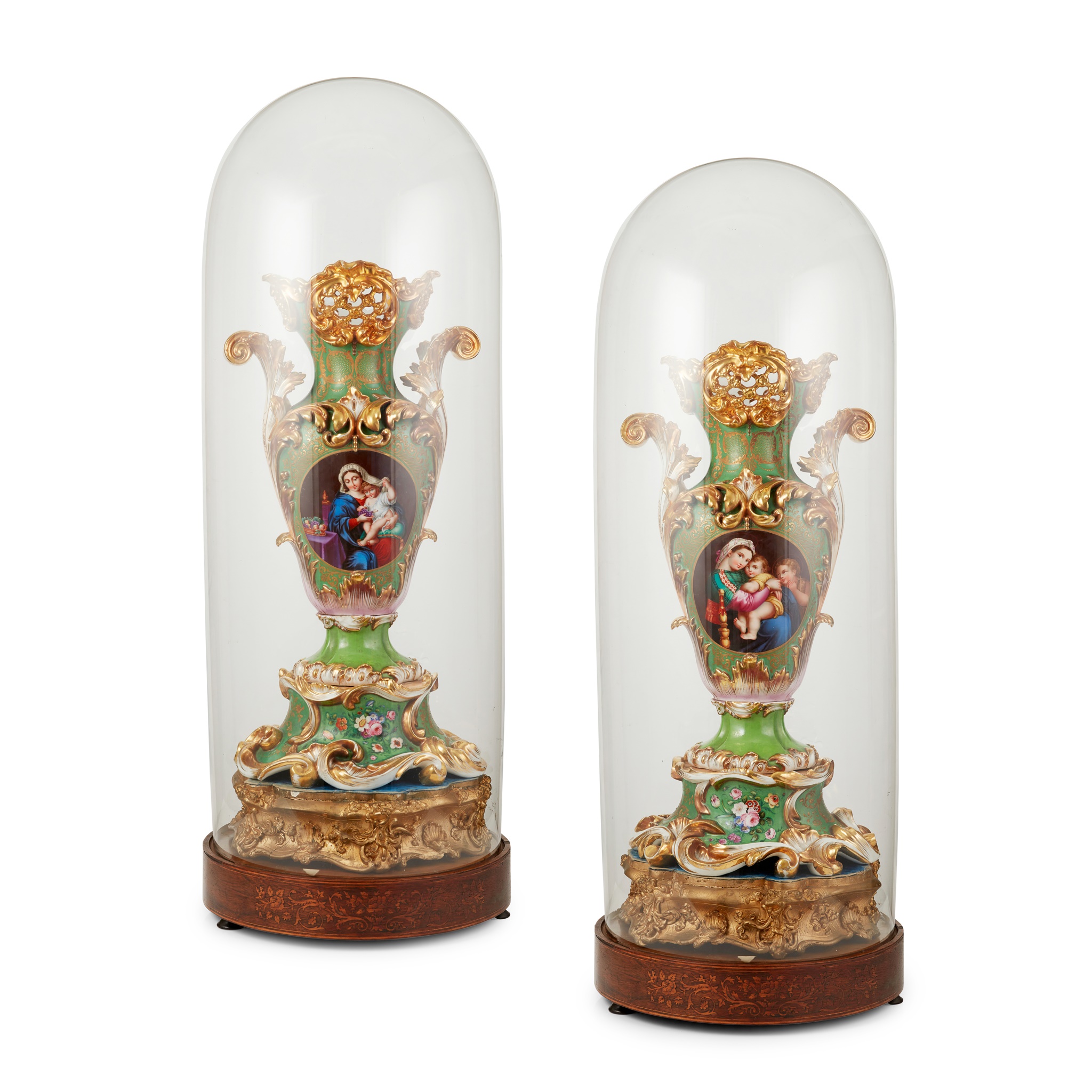 PAIR OF LARGE ROCKINGHAM GREEN GROUND VASES WITH ASSOCIATED DOMES