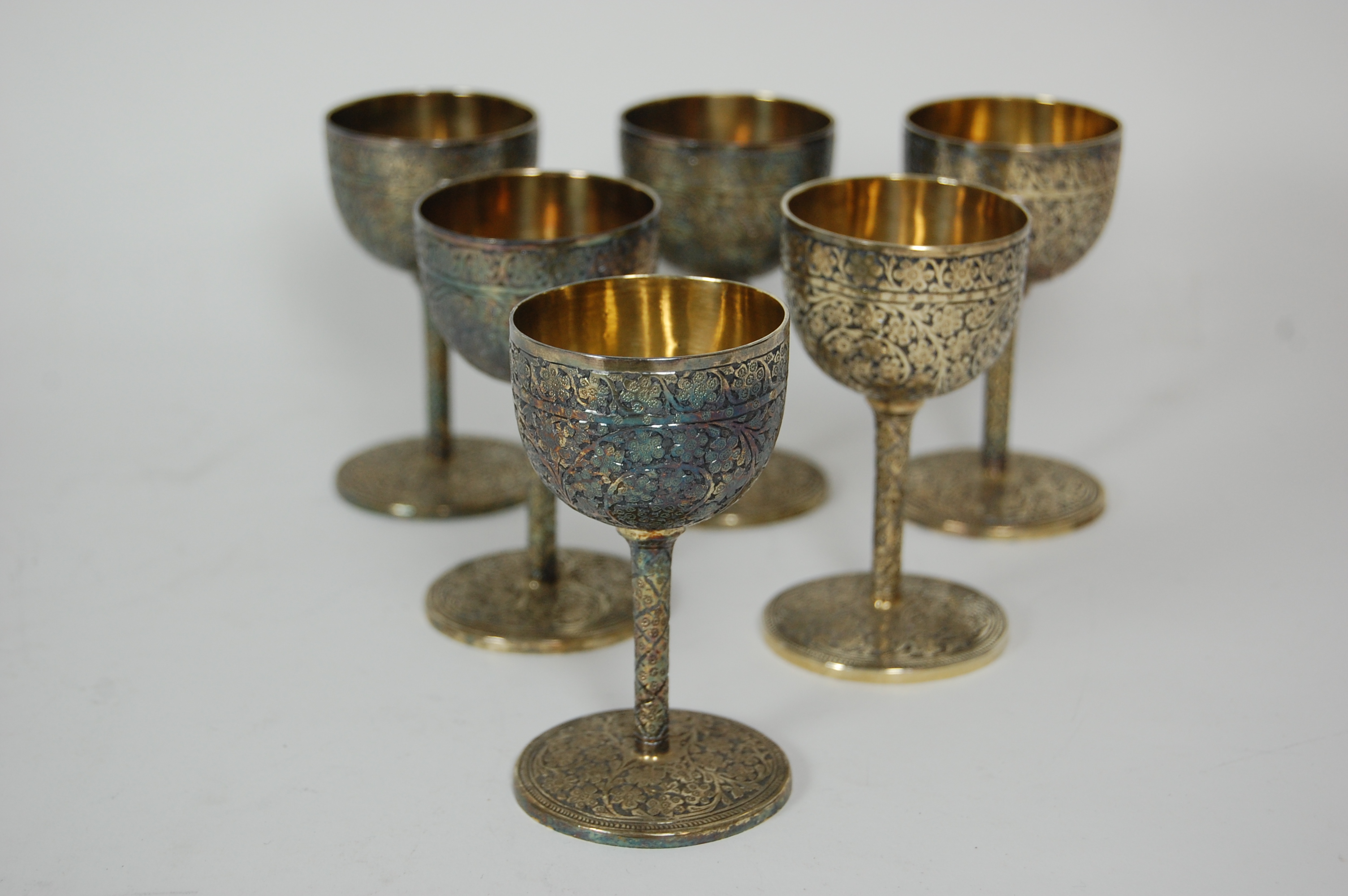 A set of twelve Indian white metal goblets