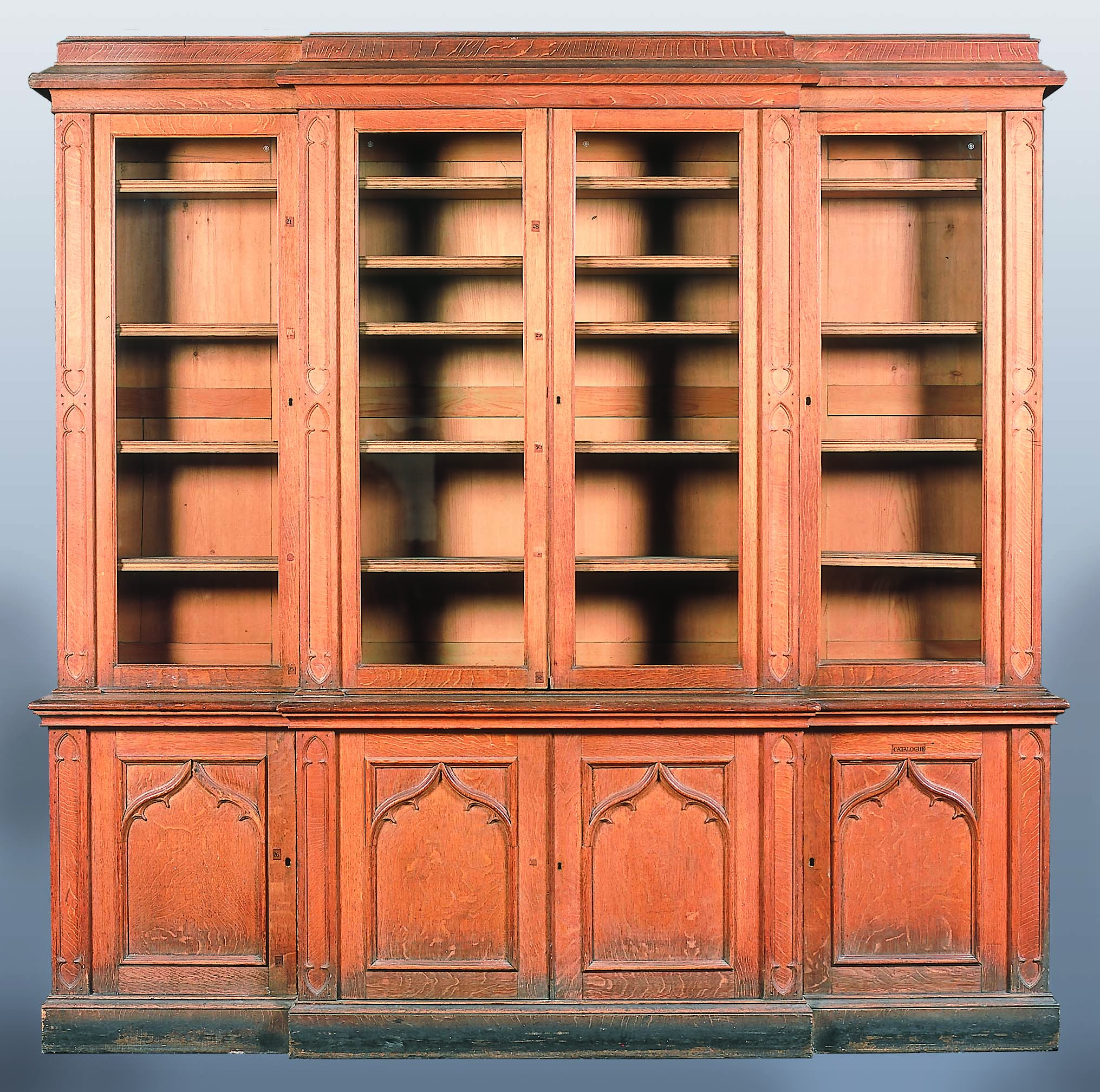 A Regency oak breakfront bookcase