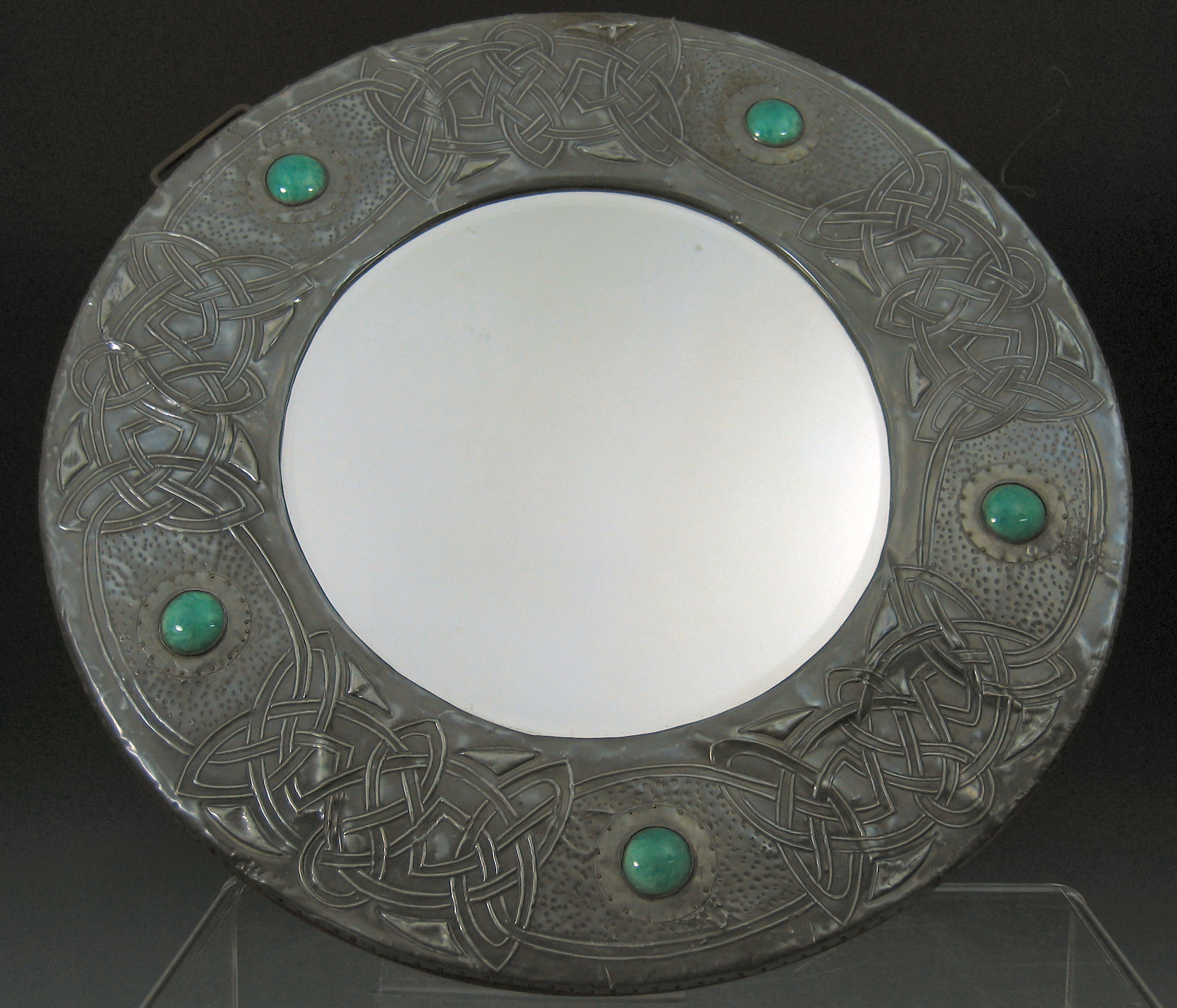 An Arts and Crafts pewter strut mirror,