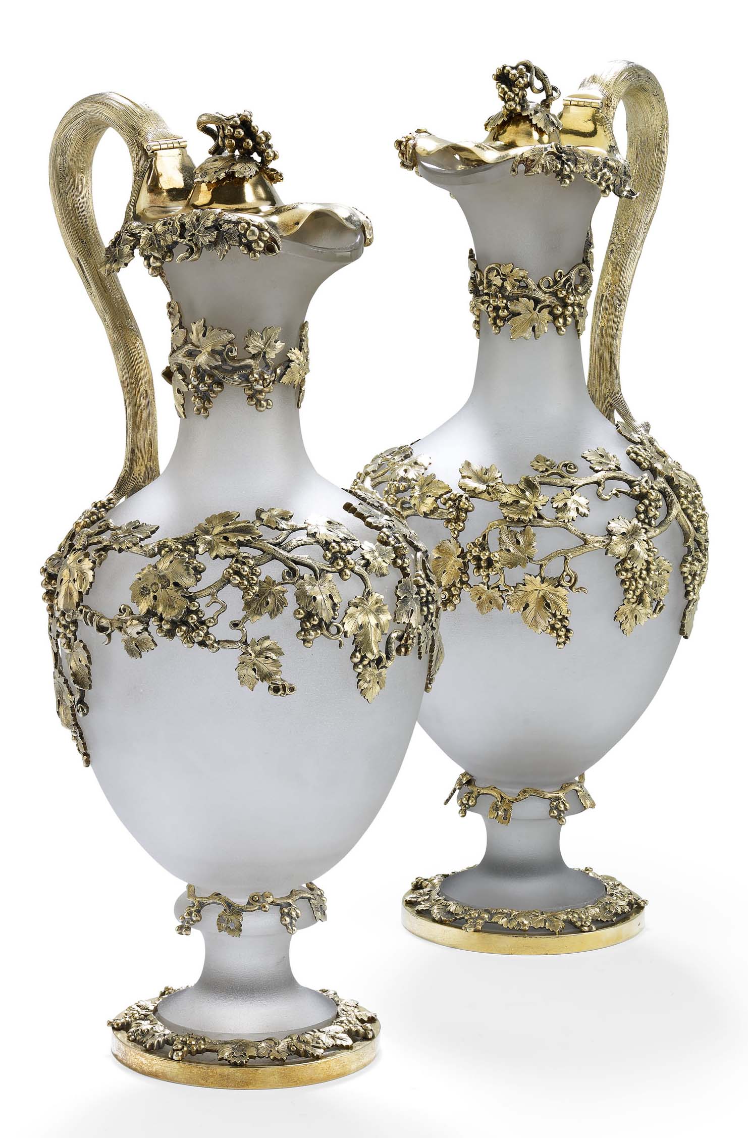 A fine pair of Victorian silver-gilt mounted claret jugs