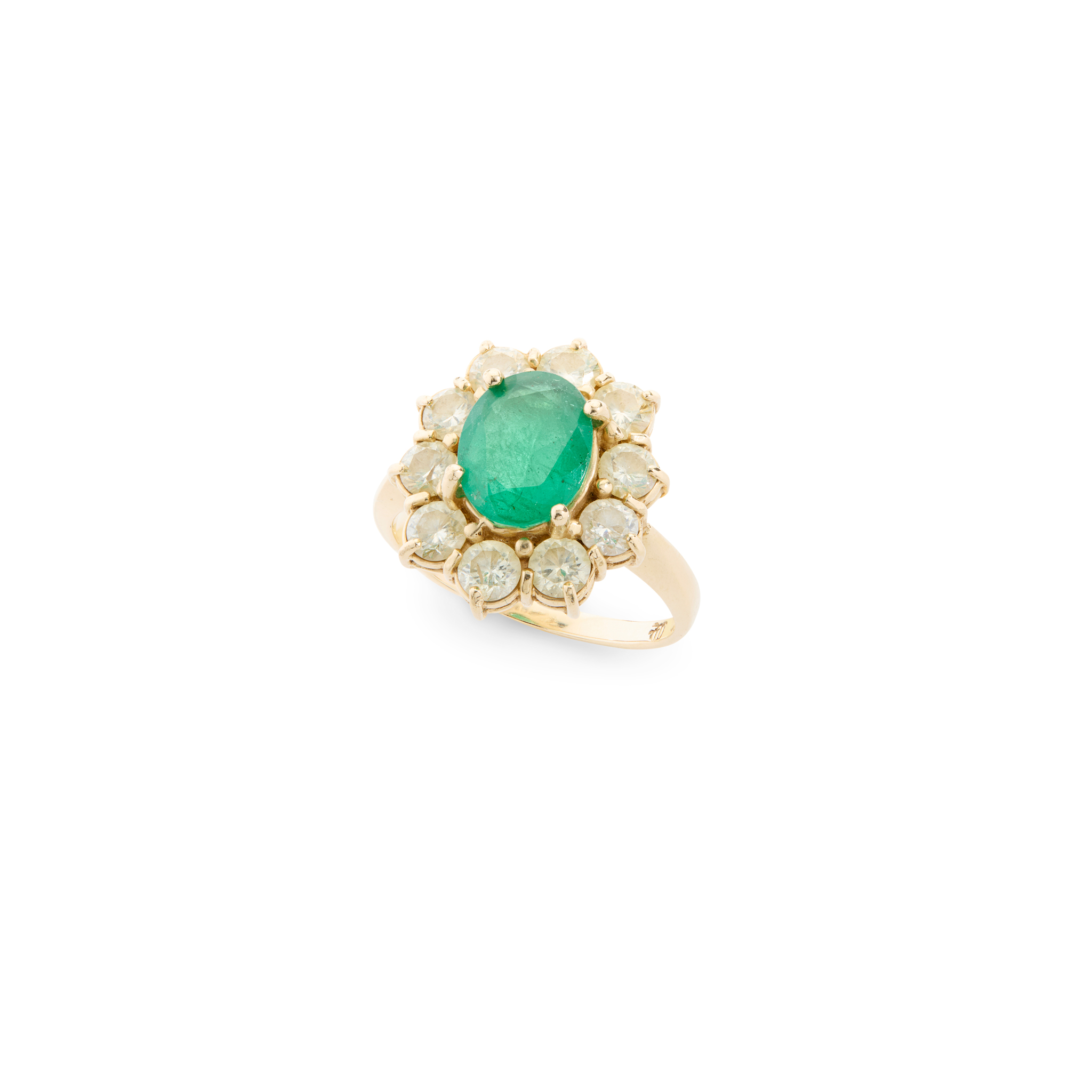 An emerald and diamond cluster ring