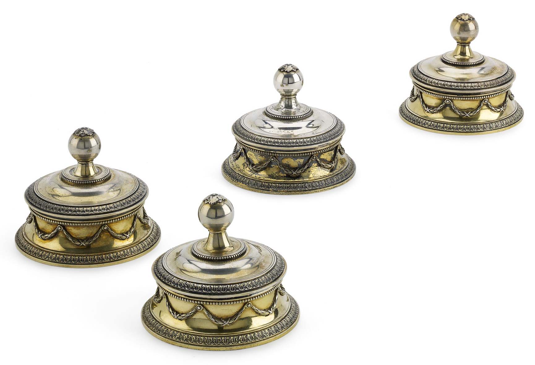 A set of four Fabergé silver-gilt covered bowls
