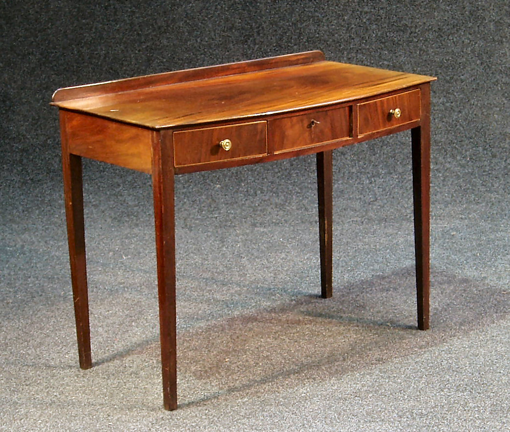 A George III mahogany bowfront side table,
