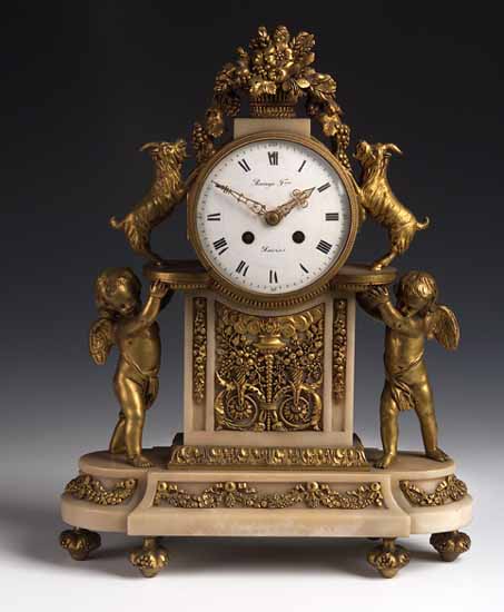 A French chased gilt bronze and enamelled timepiece