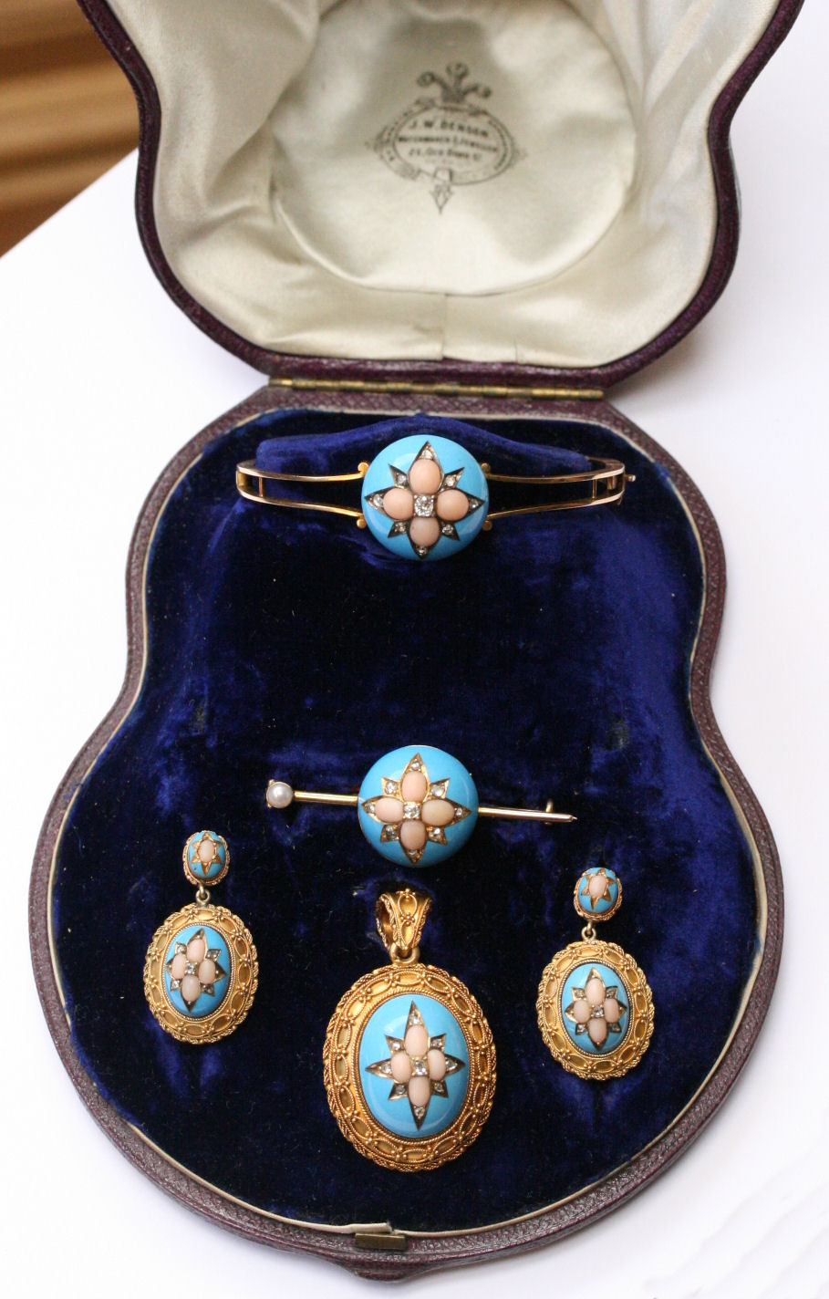 A mid-Victorian enamelled, coral and diamond set parure