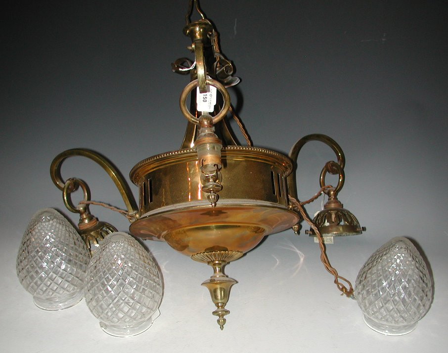 An Edwardian brass three branch light