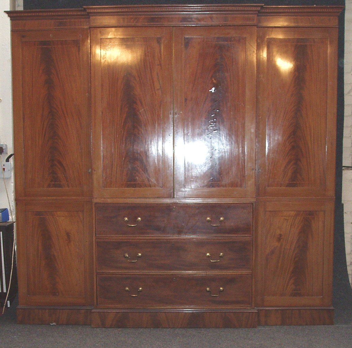 An Edwardian mahogany and satinwood banded break front wardrobe,