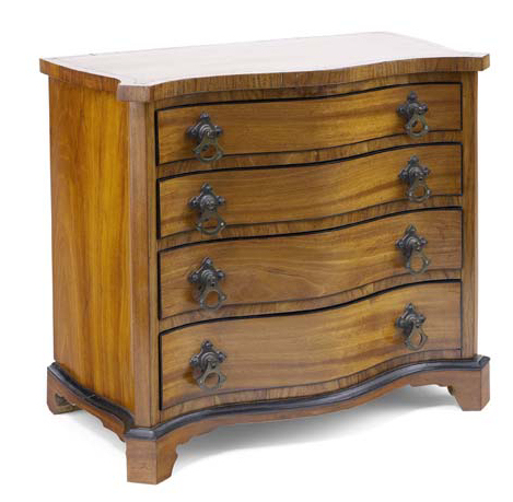 A late 19th century satinwood and tulipwood crossbanded miniature serpentine chest