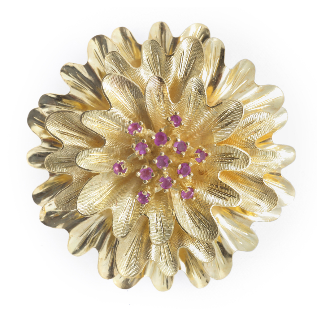 A ruby set brooch