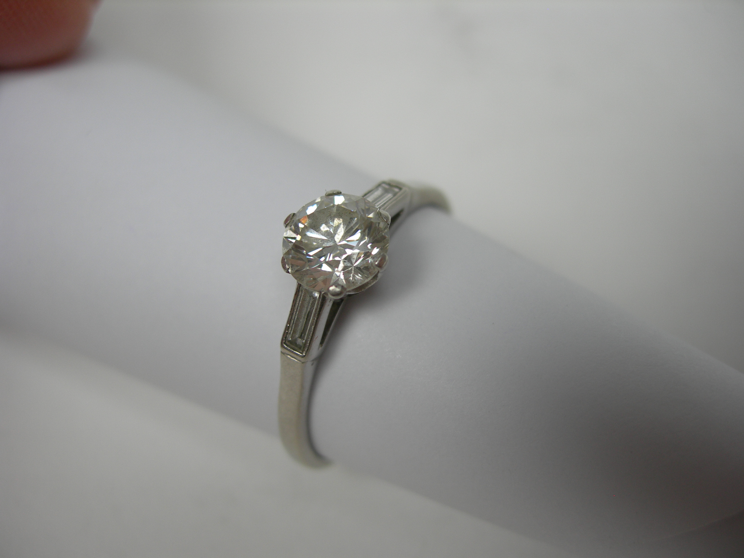 A platinum mounted diamond set ring,