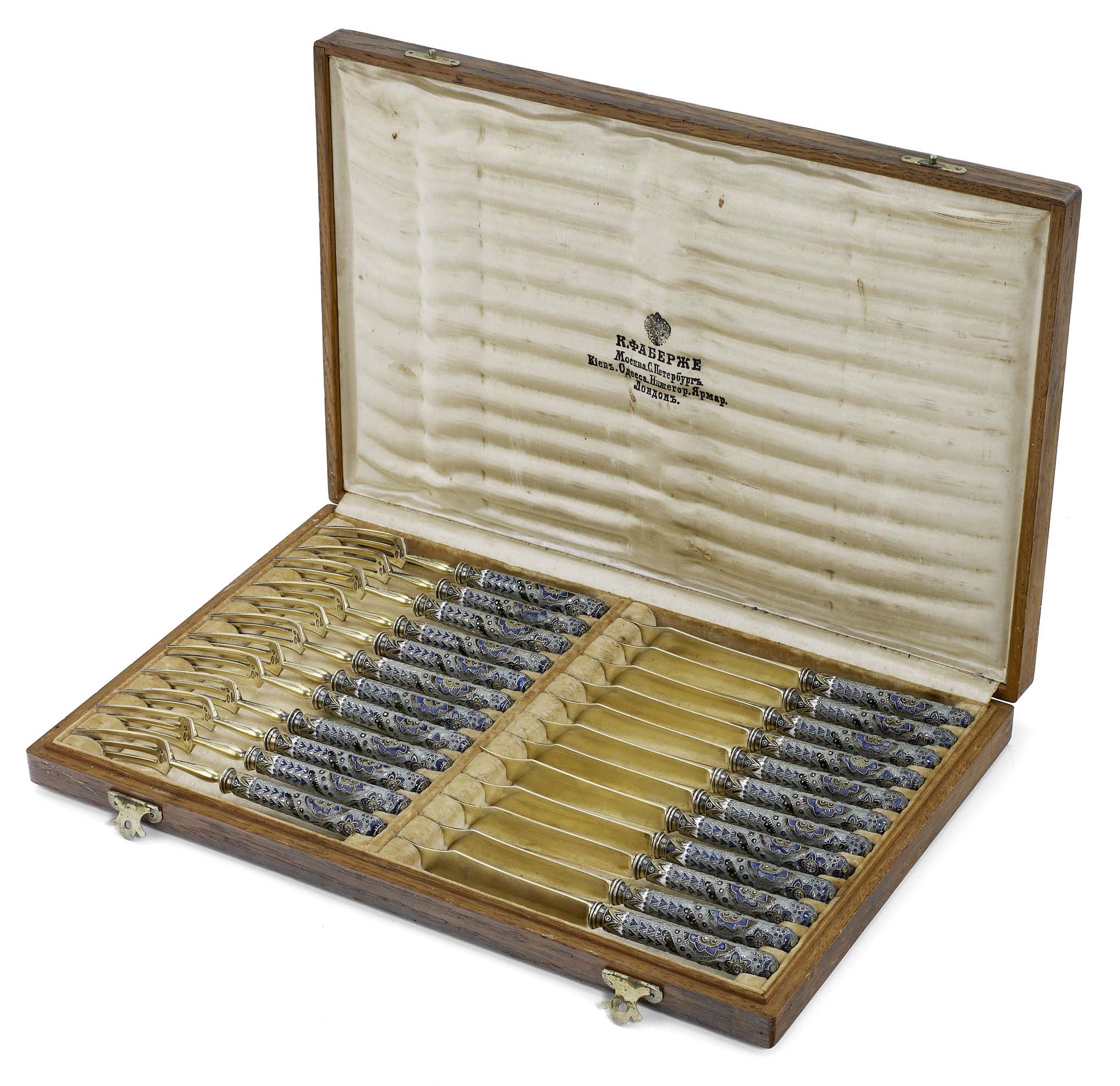 A cased set of twelve Fabergé silver-gilt and cloisonné enamel dessert-knives and forks