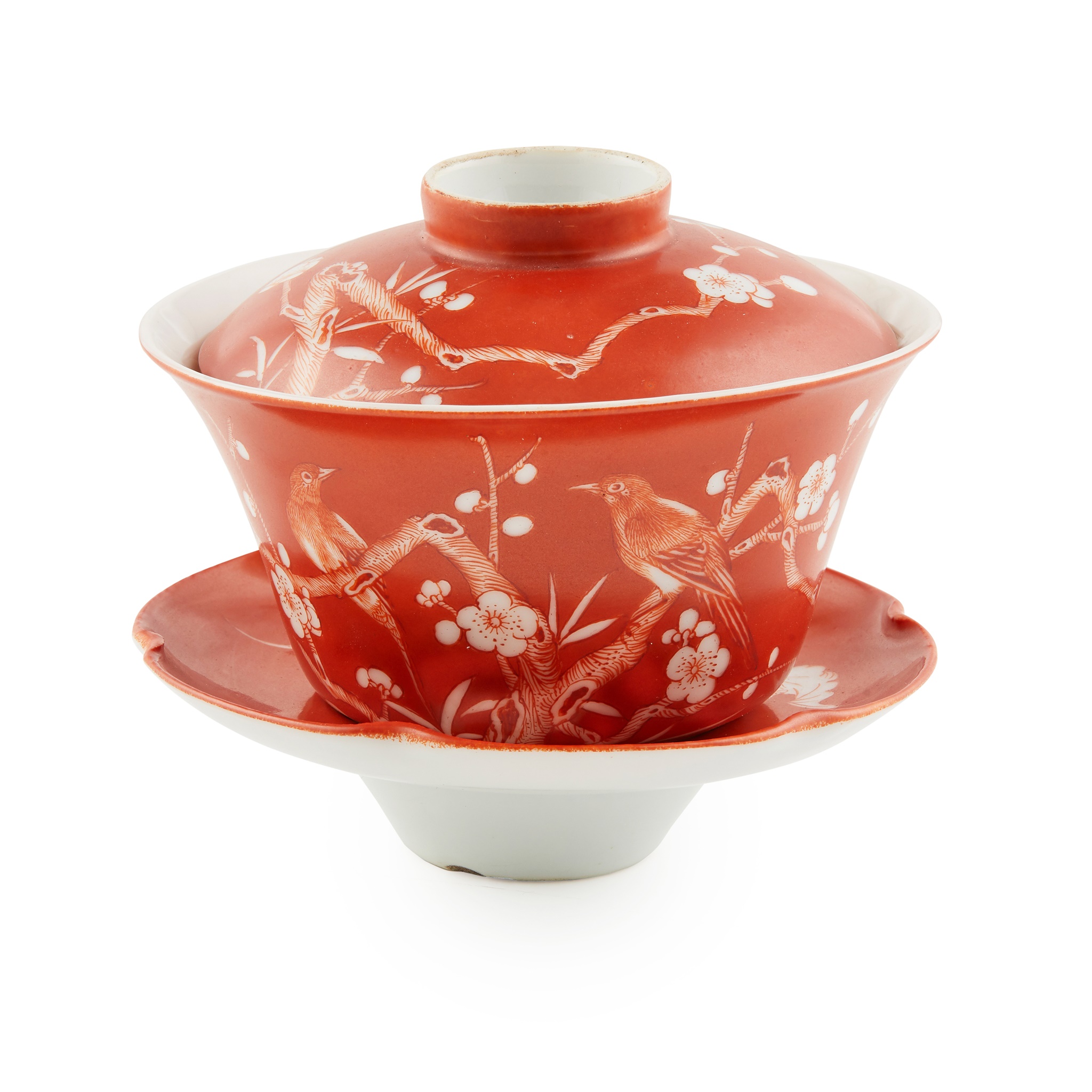 RED-GROUND RESERVE-DECORATED 'PRUNUS' LIDDED CUP AND SAUCER