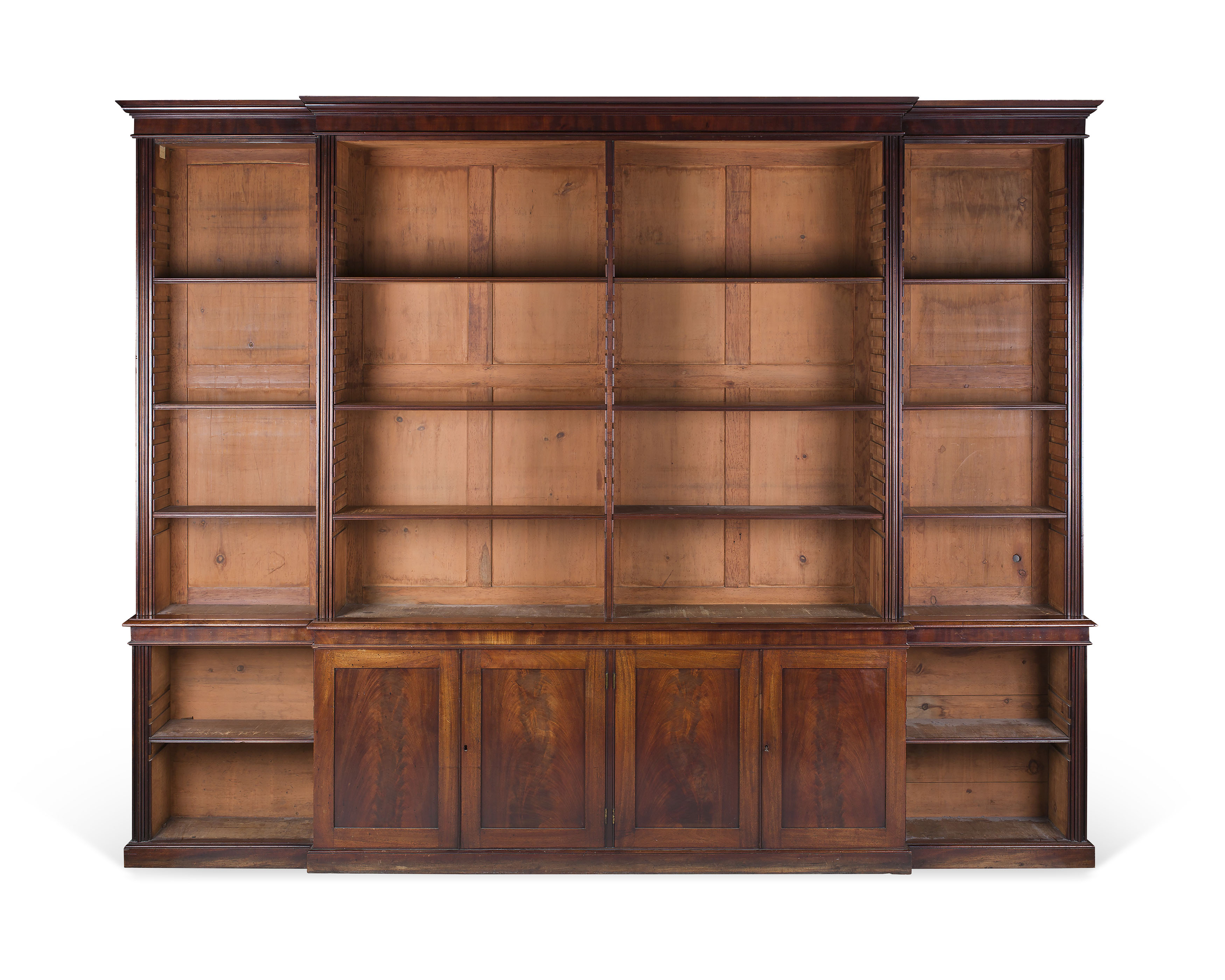 GEORGE III MAHOGANY BREAKFRONT OPEN BOOKCASE