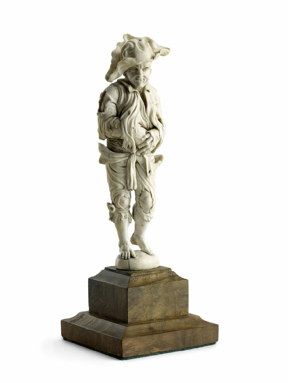 An early 18th century ivory figure of a beggar, Dresden Circle of Wilhelm Kruger
