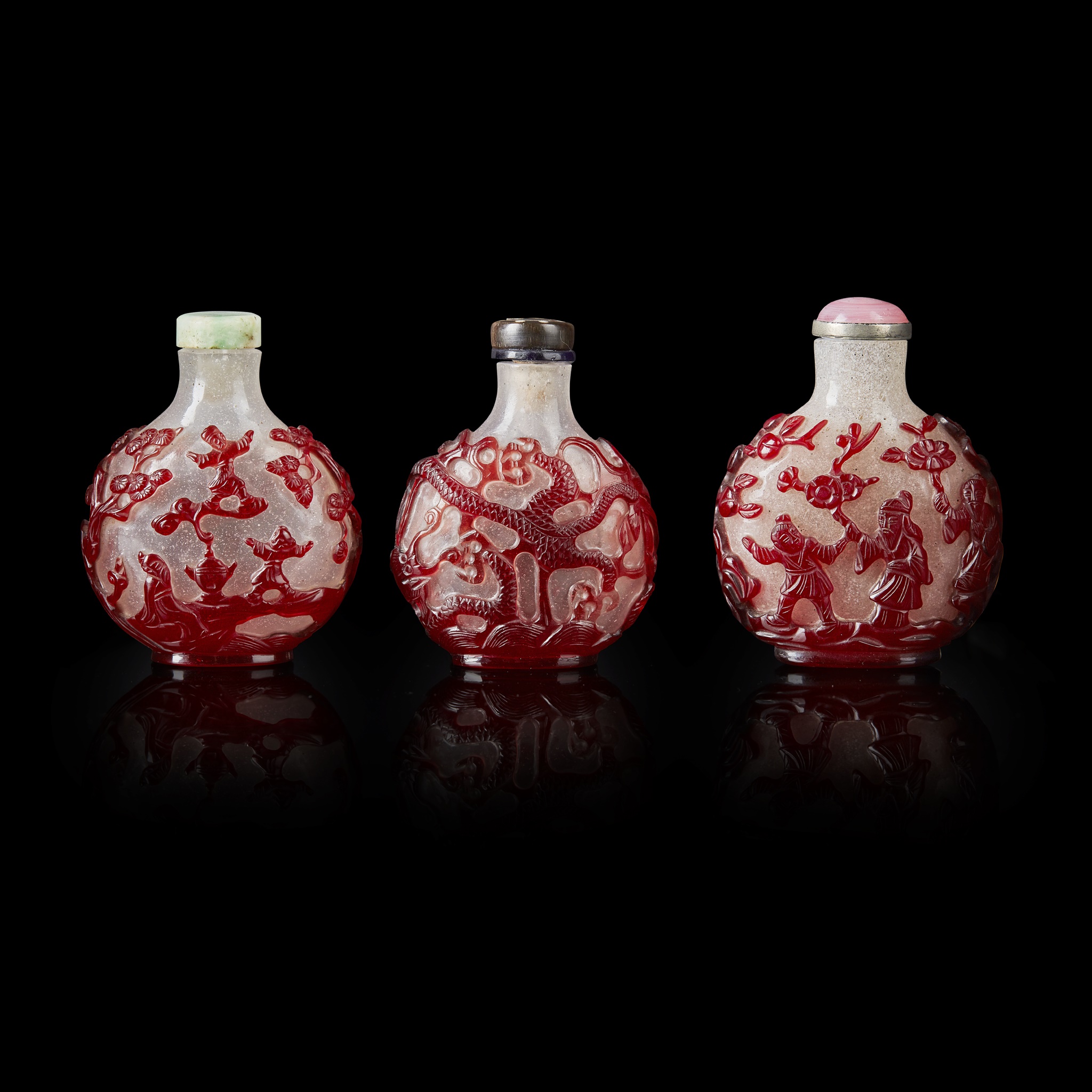 GROUP OF THREE RED OVERLAY PEKING GLASS SNUFF BOTTLES