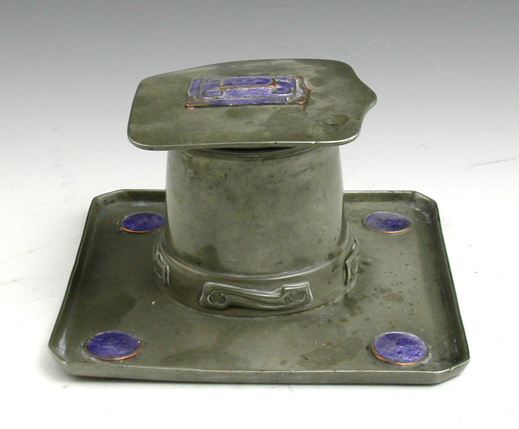 A Tudric pewter and enamel set inkwell,