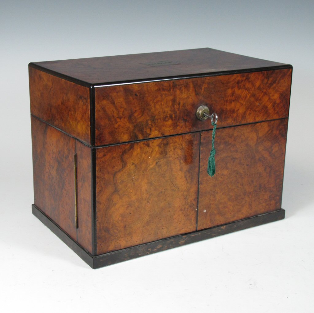 A 19th century walnut and ebonised tantalus