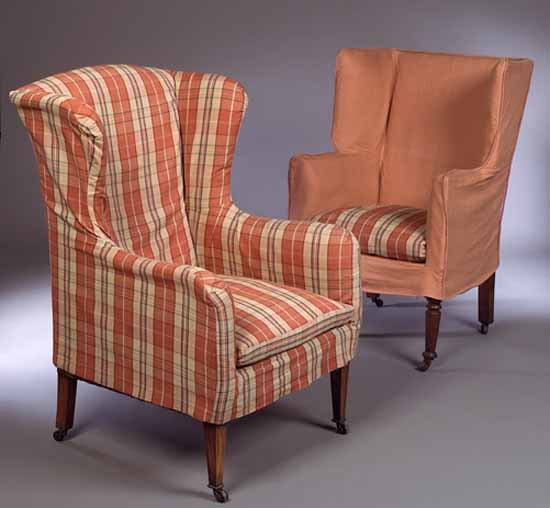 An early 19th century mahogany framed wing armchair