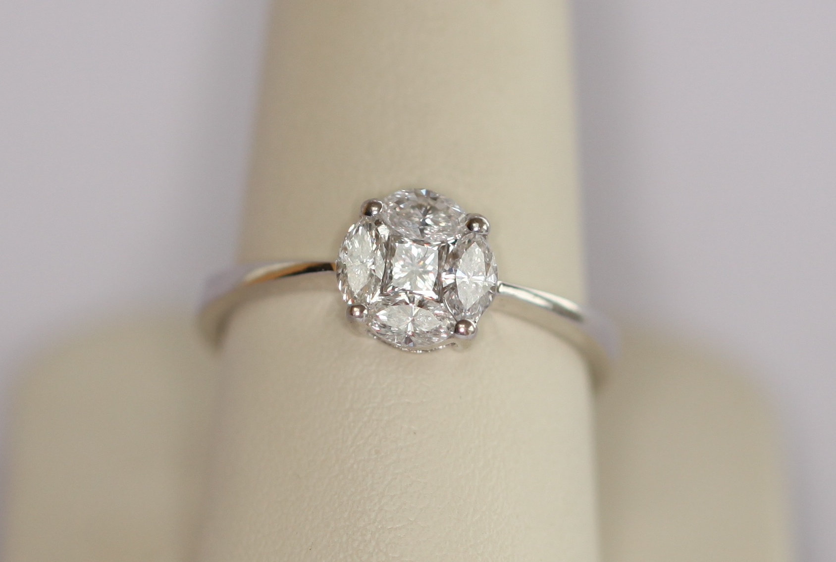 An 18ct white gold mounted diamond cluster ring