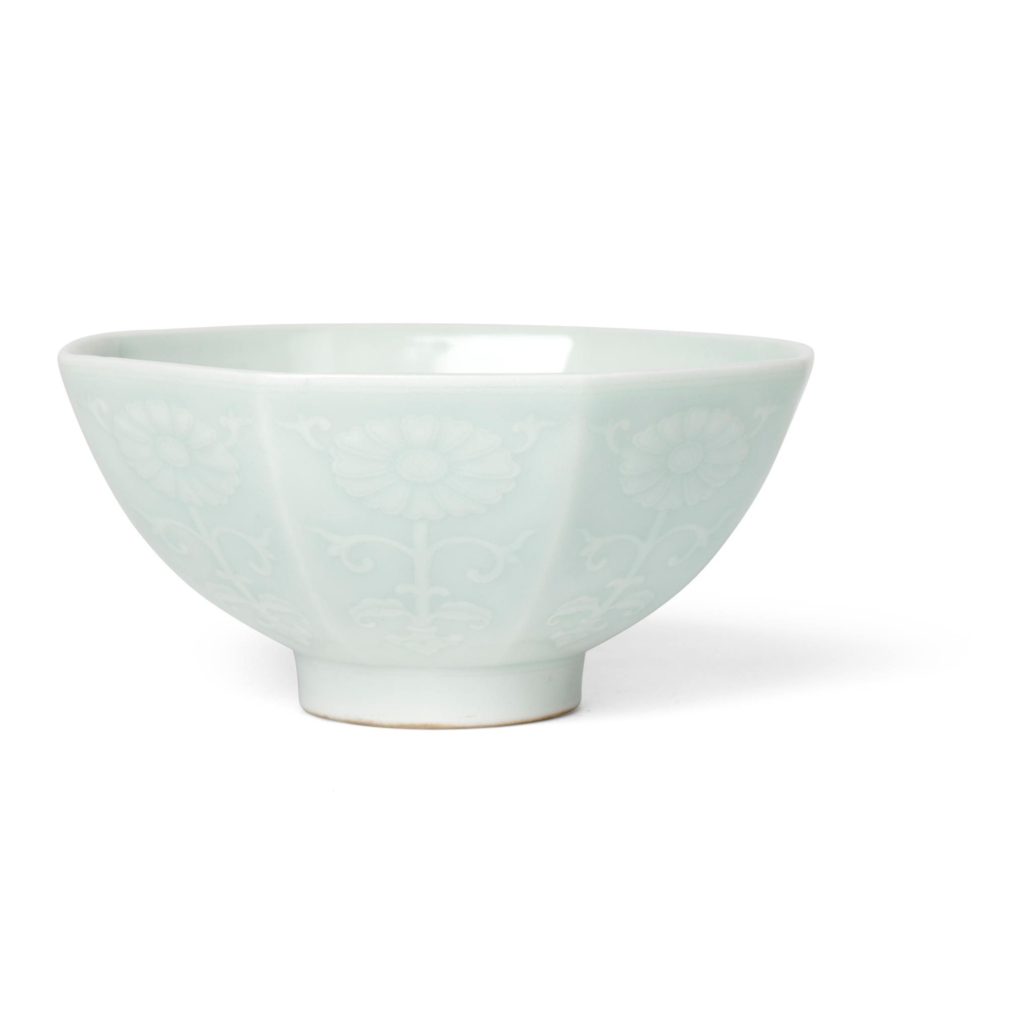 CHINESE CELADON-GLAZED RELIEF-DECORATED 'FLORAL' OCTAGONAL CUP