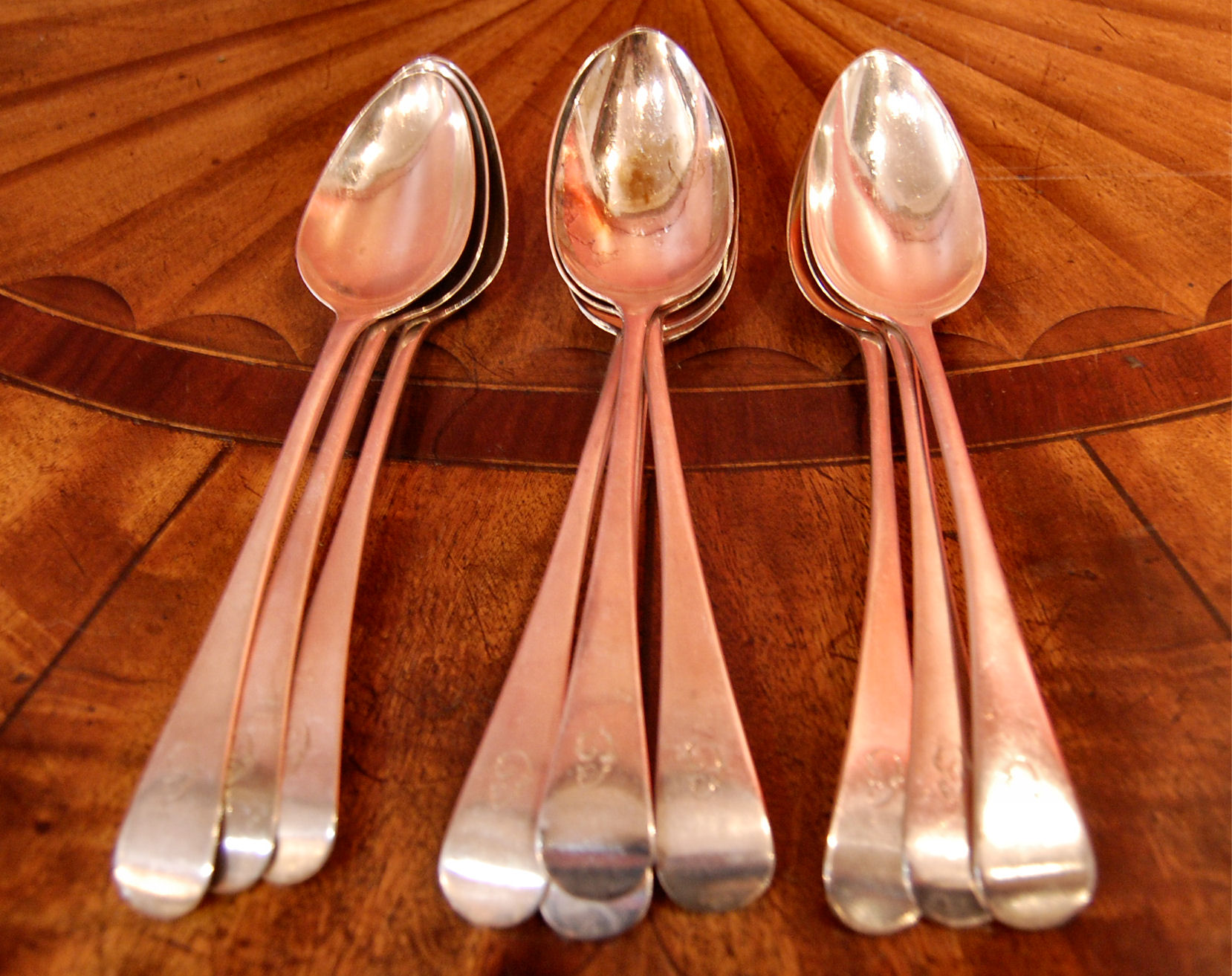 A set of ten George III silver table spoons