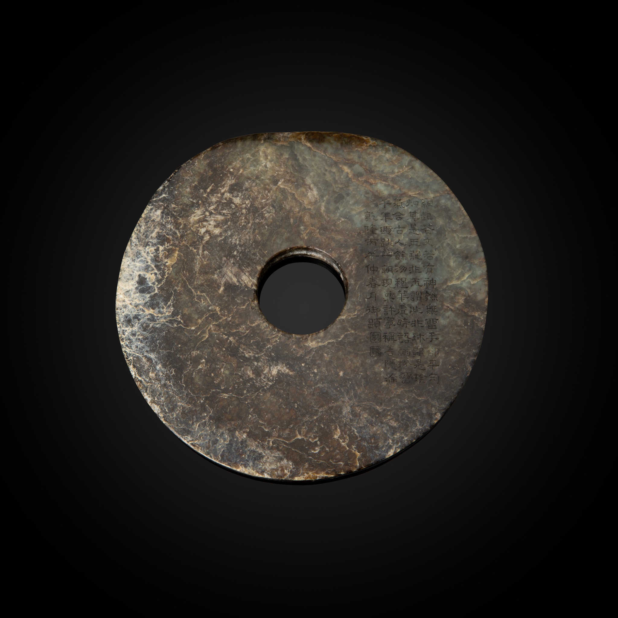 MOTTLED DARK BROWNISH-GREEN JADE DISC, BI