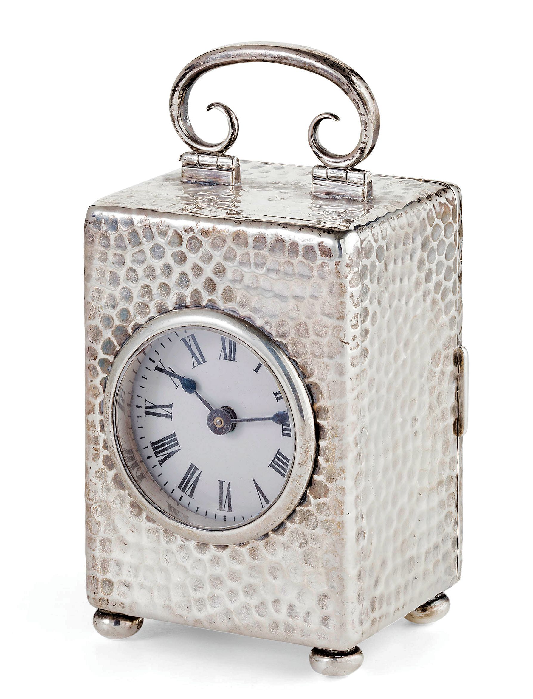 A silver cased carriage clock