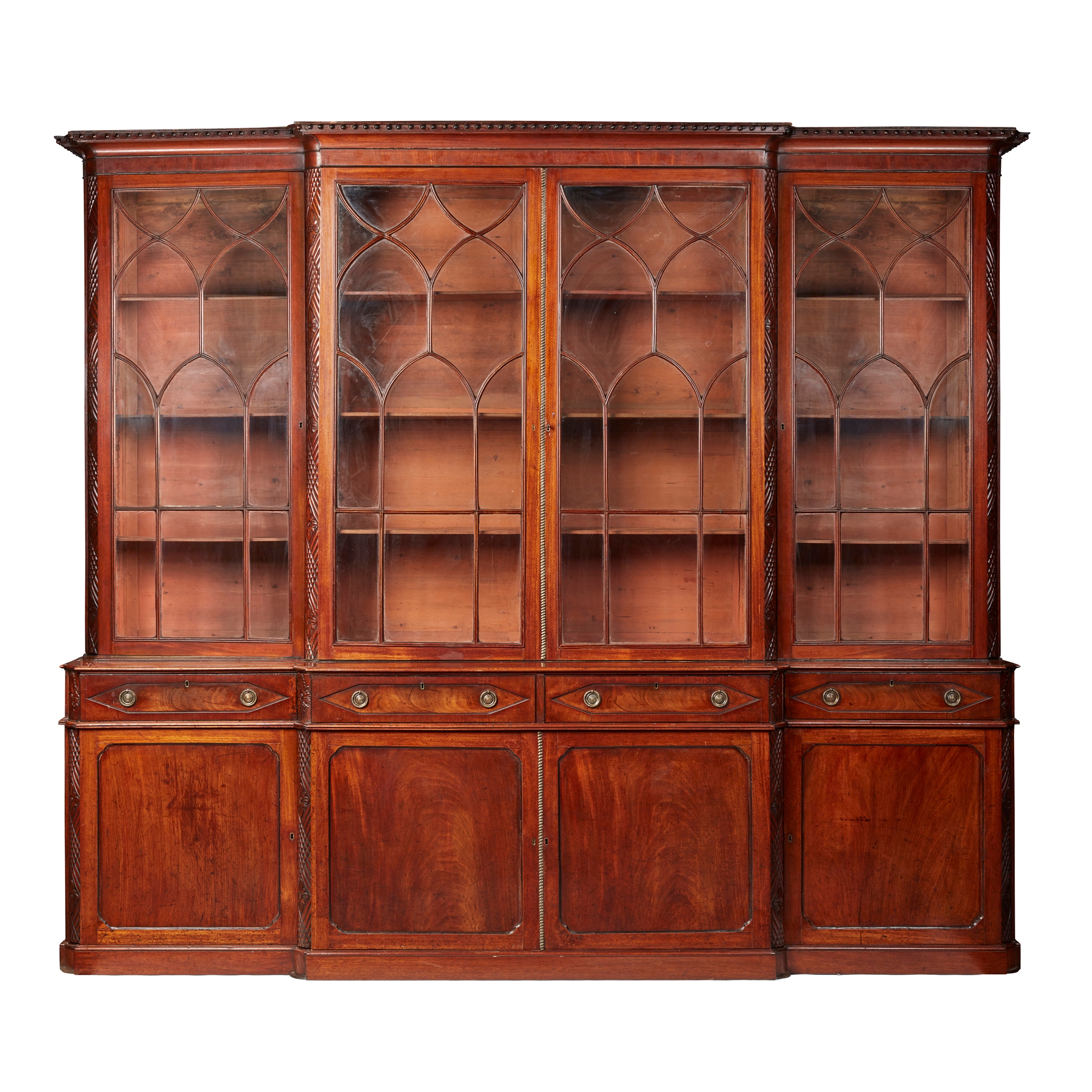 LATE REGENCY MAHOGANY AND EBONY BREAKFRONT BOOKCASE