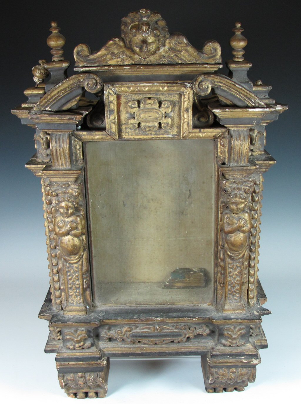 A 17th century Continental giltwood reliquary wall cabinet