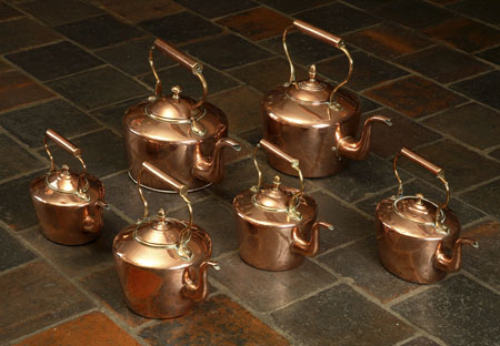 A collection of six Victorian copper kettles