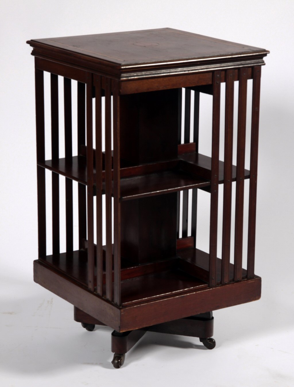 An Edwardian mahogany revolving book case